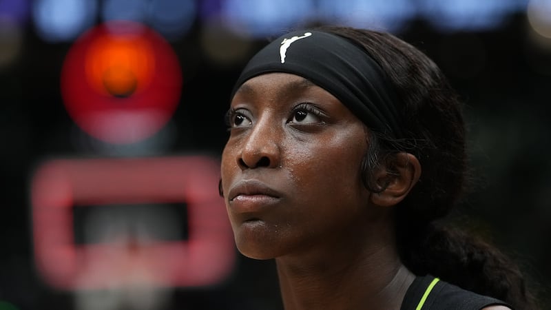 Seattle Storm guard Flau'jae Johnson walks off the court after a WNBA basketball game against...