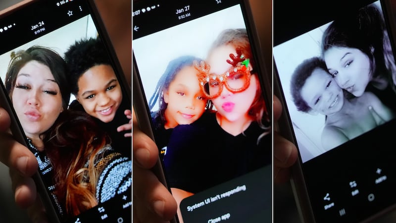 Cheyenne Hangaman shows a photograph of her and her sons, Kaleb, 8, Howard, 6, and EJ, 9, who...