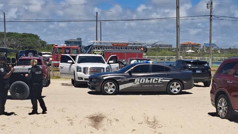 Law enforcement responds Sunday to reports of a shark bite at North Topsail Beach, North...