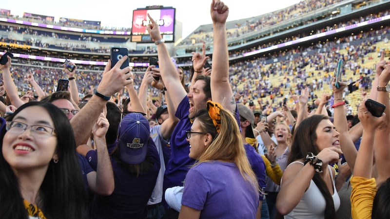 LSU fans stormed the field after the Tigers beat the Georgia Bulldogs, 36-16, in Tiger Stadium...
